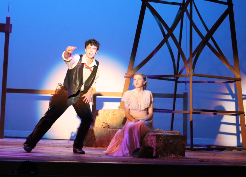 Alex Kurth as Curly McLain and Lily Rogers as Laurey Williams perform a scene during dress rehearsal for the Chelmsford High Theatre Guild's production of "Oklahoma!"