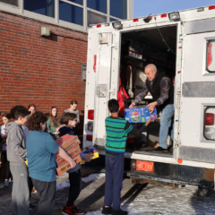 McCarthy Middle School students help load Project 300 donations into the Salvation Army truck on Thursday, Jan. 16, 2025.