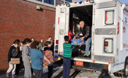McCarthy Middle School students help load Project 300 donations into the Salvation Army truck on Thursday, Jan. 16, 2025.