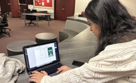 Chelmsford High School junior Reya Kannan shows how she has been coding her new app, Yard2Yum, which won her the Congressional App Challenge in Massachusetts's Third Congressional District.