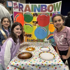 South Row third graders Isabella Arena, Ava Mae Gauvin and Victoria Thornton with their science fair project titled "Be The Rainbow."
