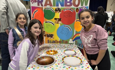 South Row third graders Isabella Arena, Ava Mae Gauvin and Victoria Thornton with their science fair project titled "Be The Rainbow."