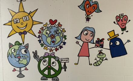 A section of Bren Bataclan's completed mural in the hallway at Harrington Elementary School.