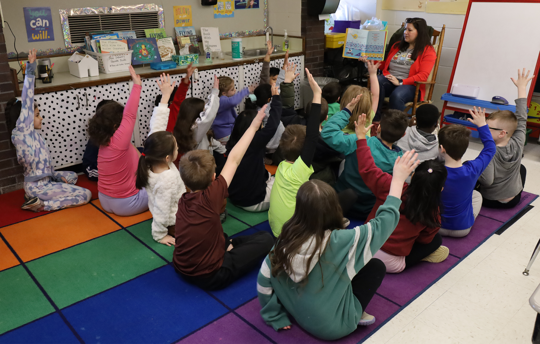 Byam School Association member Melissa McCaffrey reads “Crash, Splash, or Moo!” to Ms. DuDevoir’s second grade class at Byam Elementary School during the annual Chelmsford Community Read-In on Wednesday, March 4.