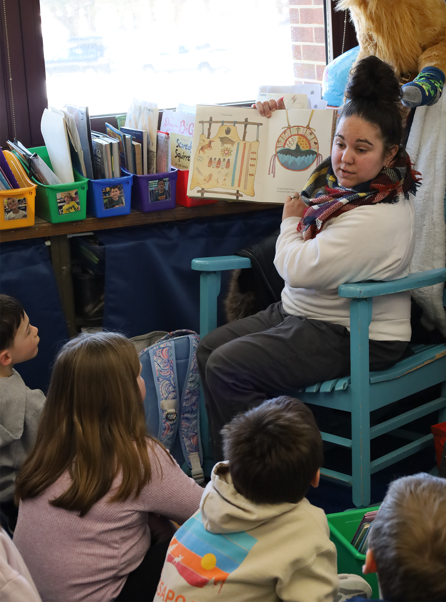 Dominique Rowe, a youth service specialist at Chelmsford Public Library, reads to students in Ms. Sullivan’s second grade class at Byam Elementary School on Wednesday, March 4.