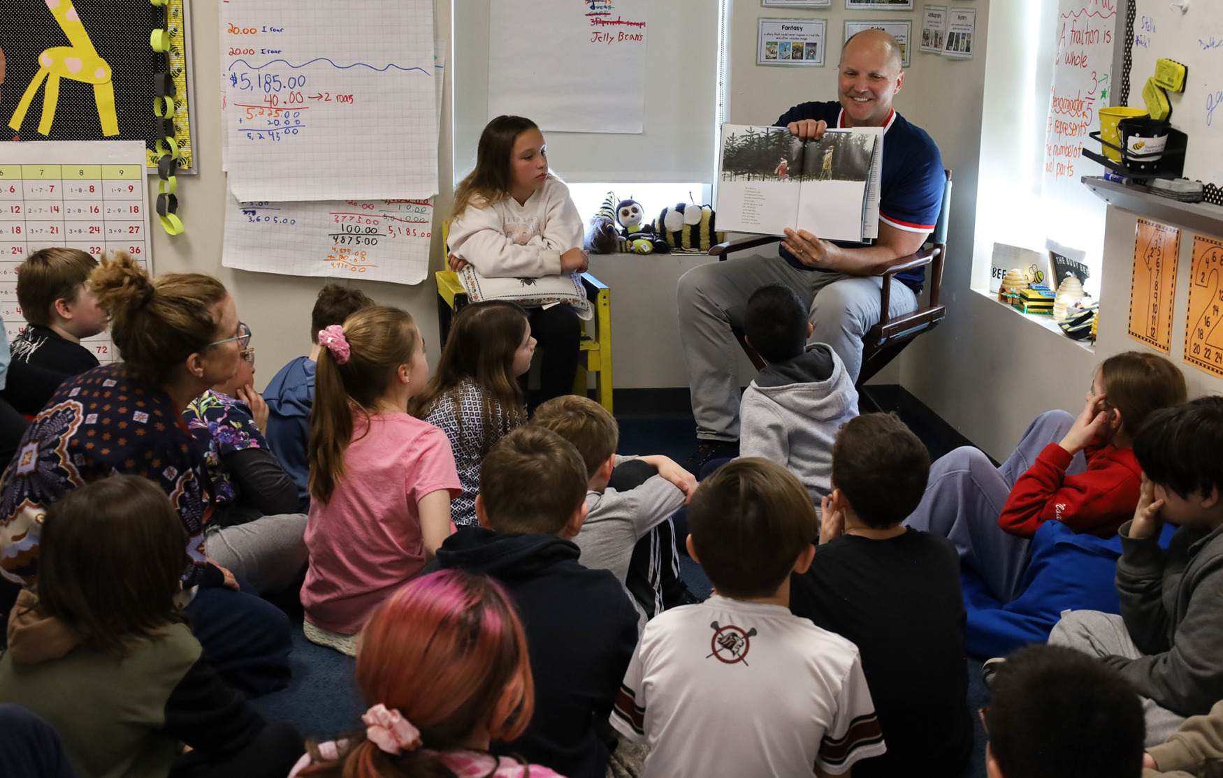 Parker Middle School Principal Josh Blagg reads “Owl Moon” to the students in Ms. Babson’s fourth grade class at Byam Elementary School during the annual Chelmsford Community Read-In on Wednesday, March 4.