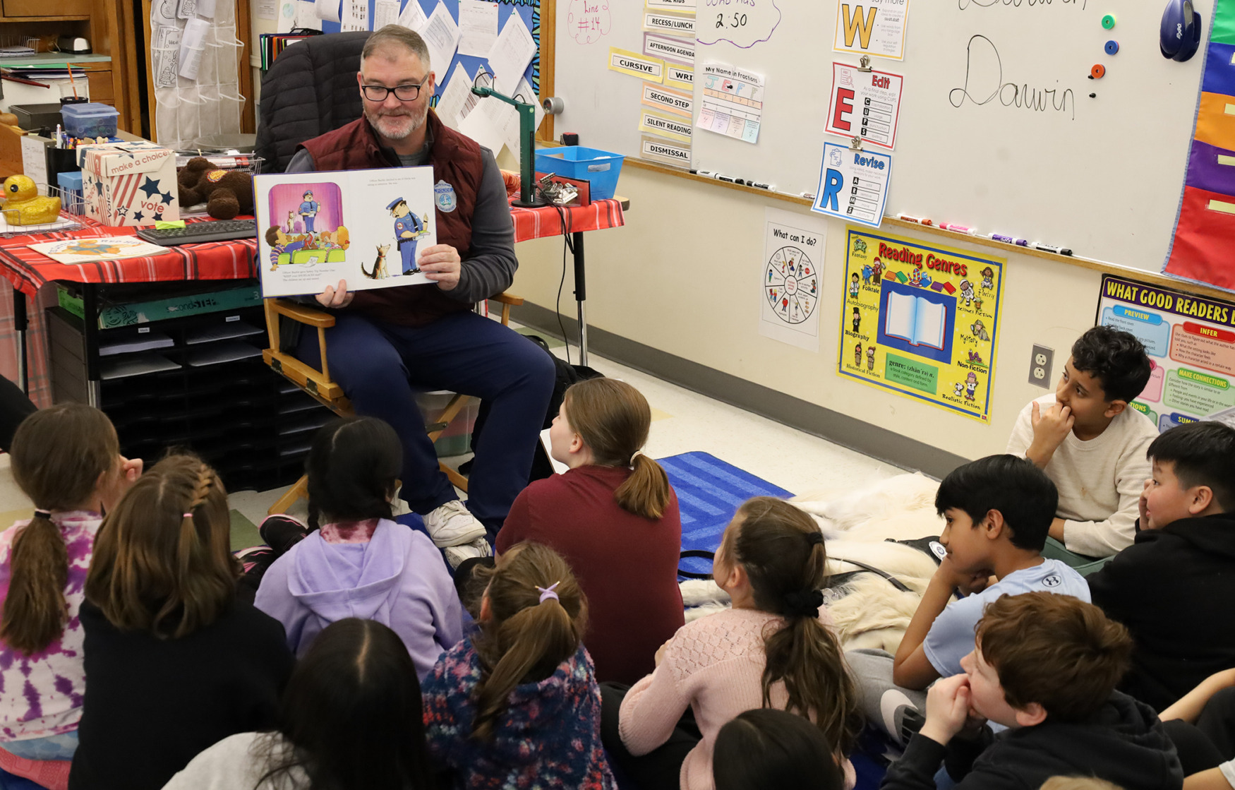 School Resource Officer Dan Sullivan reads “Officer Buckle & Gloria” to Mr. L’Abbe’s third grade class at Center Elementary School during the annual Chelmsford Community Read-In on Wednesday, March 4.