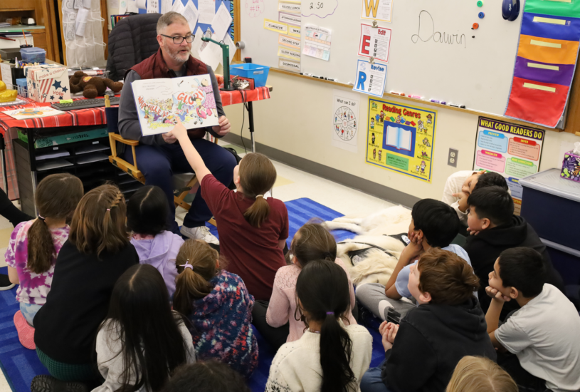 School Resource Officer Dan Sullivan reads “Officer Buckle & Gloria” to Mr. L’Abbe’s third grade class at Center Elementary School during the annual Chelmsford Community Read-In on Wednesday, March 4.