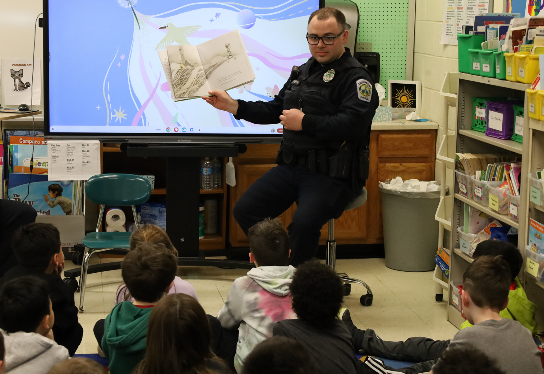 Chelmsford Police Officer Andrew Robinson reads “What To Do With An Idea” to Ms. Webber’s second grade class at South Row Elementary School during the annual Chelmsford Community Read-In on Thursday, March 5.