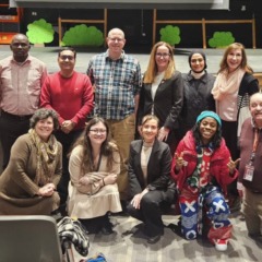 The 2026 Fulbright Teaching Excellence and Achievement (TEA) Fellows and their co-teachers pose for a photo in the Carl J. Rondina Performing Arts Center at Chelmsford High School.
