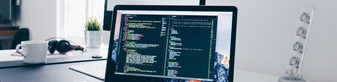 A computer with a display featuring html code.