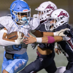 Dracut’s Phillip Dinh carries for a short gain before being tackled by Chelmsford defenders Aidan O’Donnell and Josh Valdez during Thursday’s MVC football game at Simonian Field in Chelmsford. Chelmsford captured a 25-0 win.