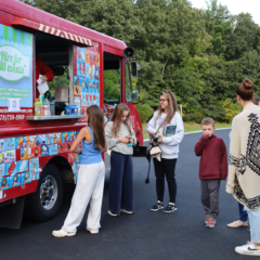 Families enjoy treats from an ice cream truck outside Byam Elementary School during the Back To School Social on Thursday, Sept. 24, 2026.